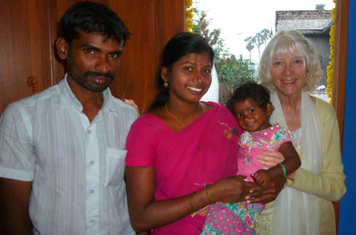Anitha and her husband
                      Kartik and baby Aditi in their new house